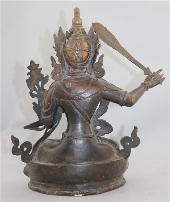 A Sino-Tibetan bronze seated figure of Manjushri, 31cm